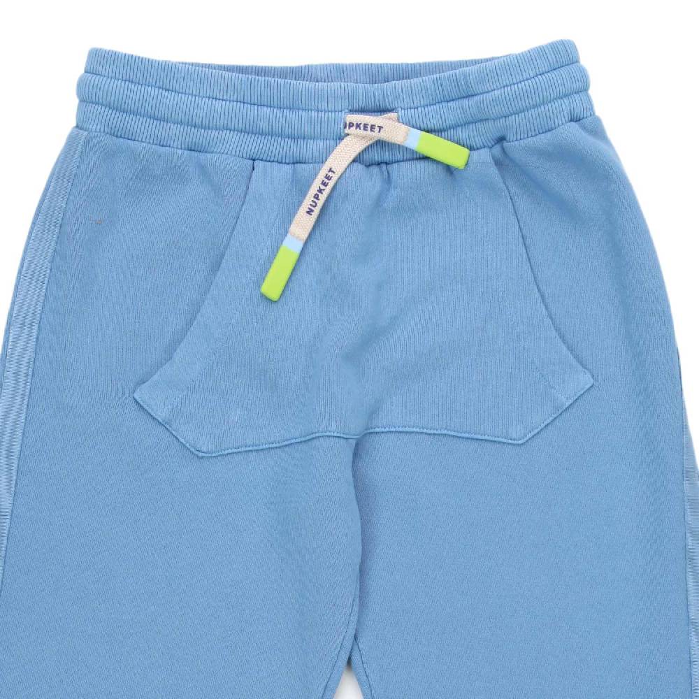 Nupkeet Pantalone Pemba indaco con marsupio 2025